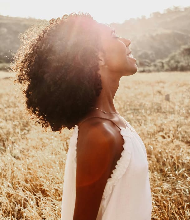 woman in sunshine and field
