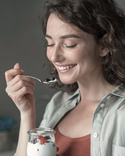 woman eating yogurt